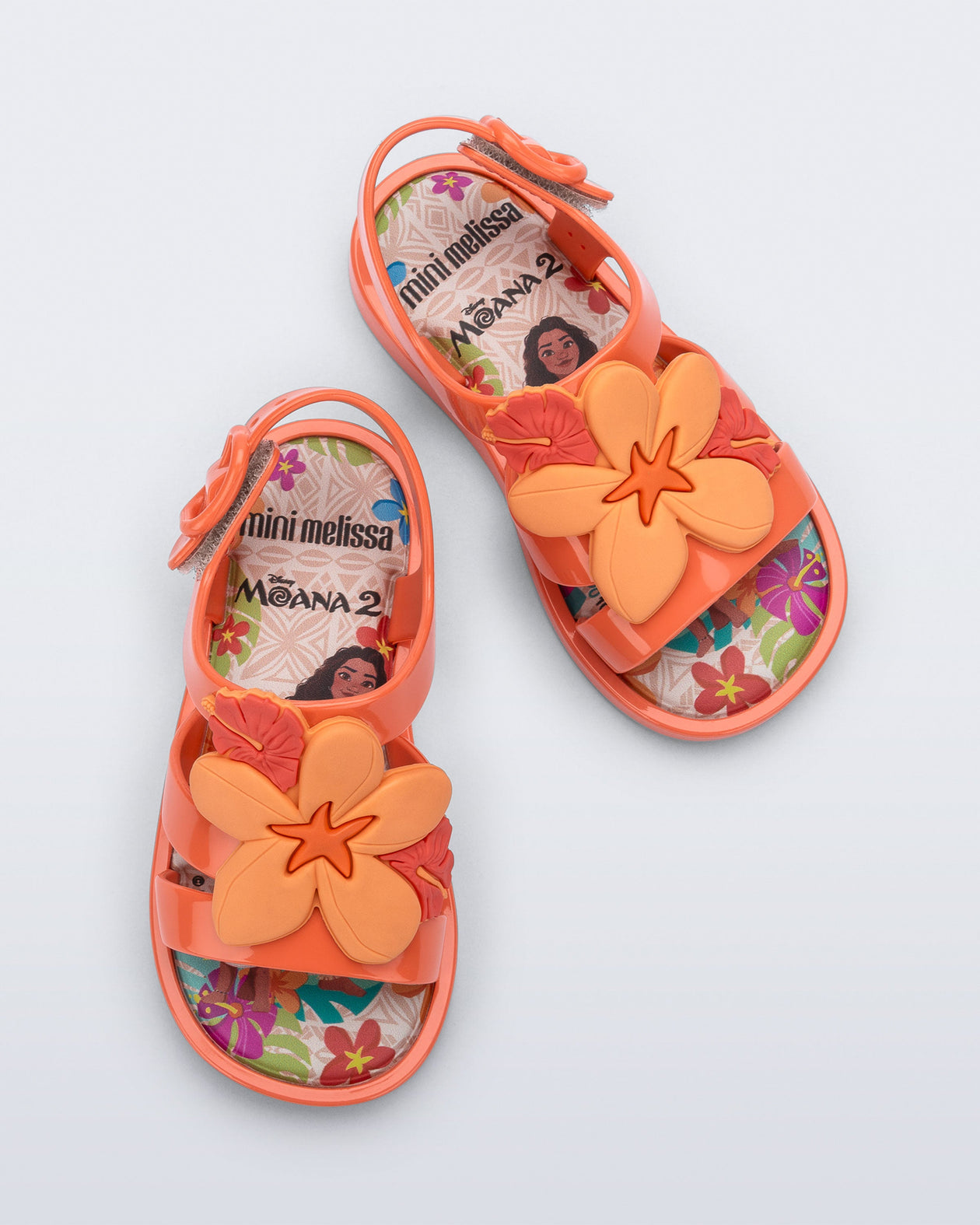 Top view of a pair of orange Colorland Moana baby sandals