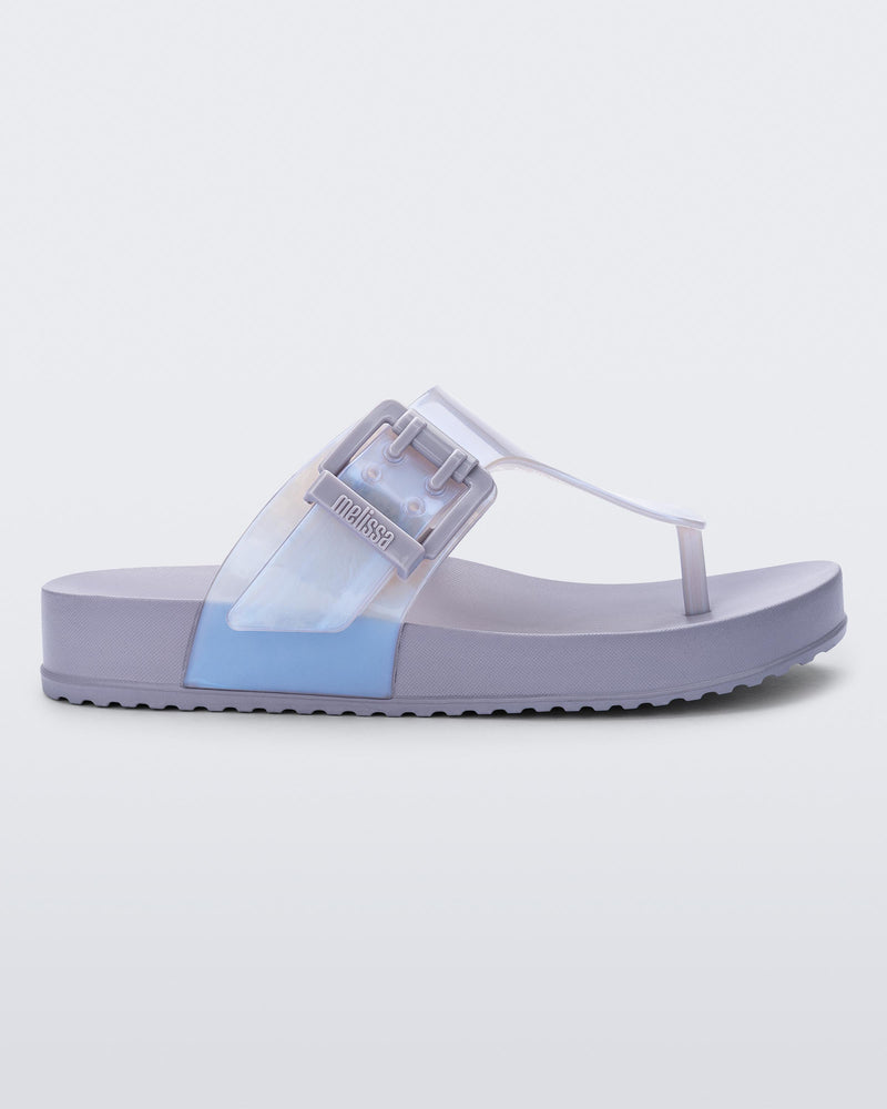 Side view of a pearly blue Cozy Flip flop