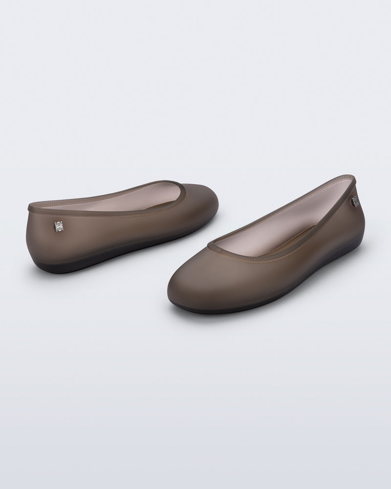 Back and angled view of a pair of clear brown Soft Ballerina Essential flats