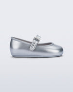 Side view of a pair of silver Soft Ballerina baby flat