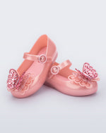 Angled view of a pair of pink Sweet Love Butterfly baby flats