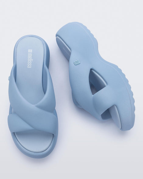 Side and top view of a pair of blue Free Rise platform slide