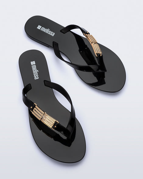 Top view of a pair of black Harmonic M Chic