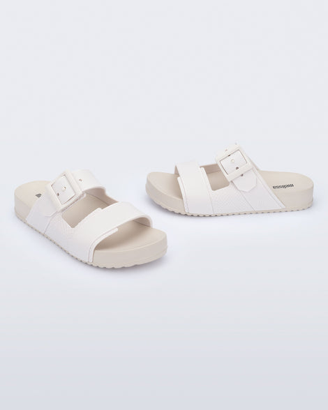 Angled view of a pair of white Cozy Connection slides