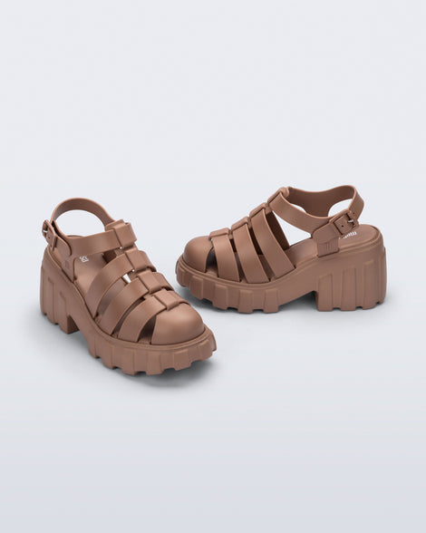 Side and front angled view of a pair of brown Megan platform sandals