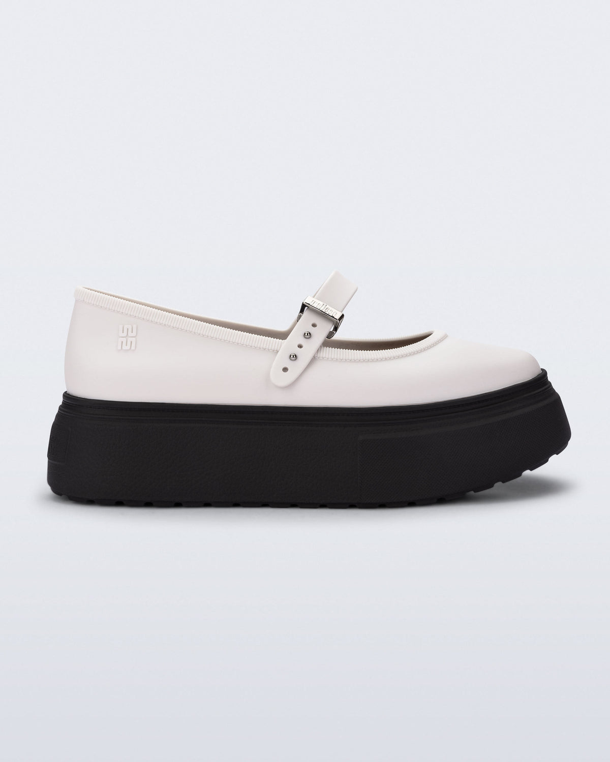 Side view of a white Soft Ballerina Platform flats with black sole