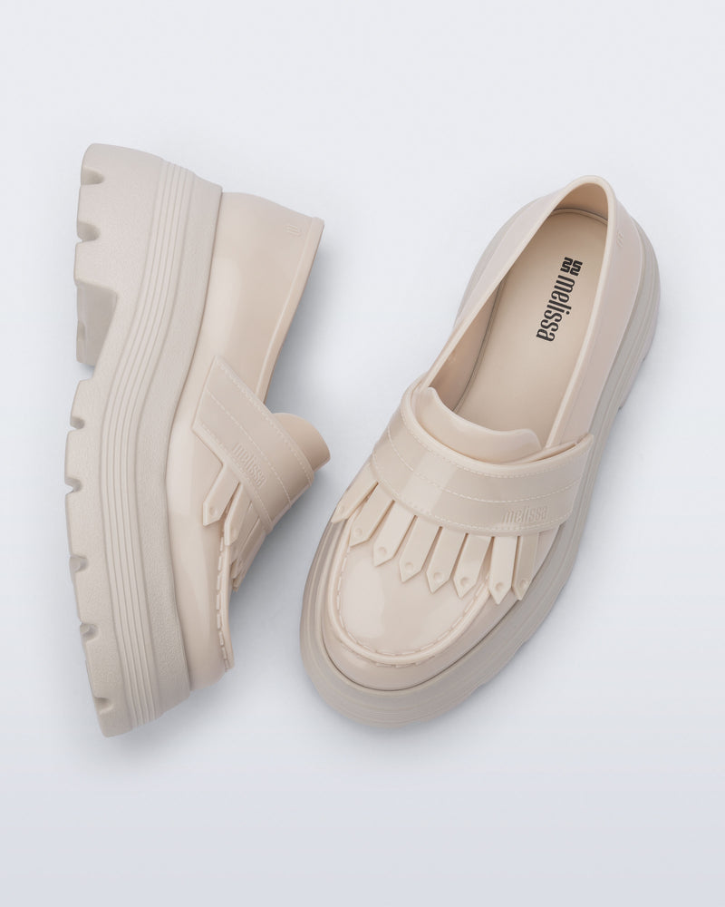 Top and side view of a pair of beige Royal Plus Platform loafers