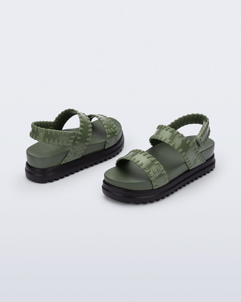 Back and angled view of a pair of green Dune Platform Sandals with faux stitching on the straps and black sole