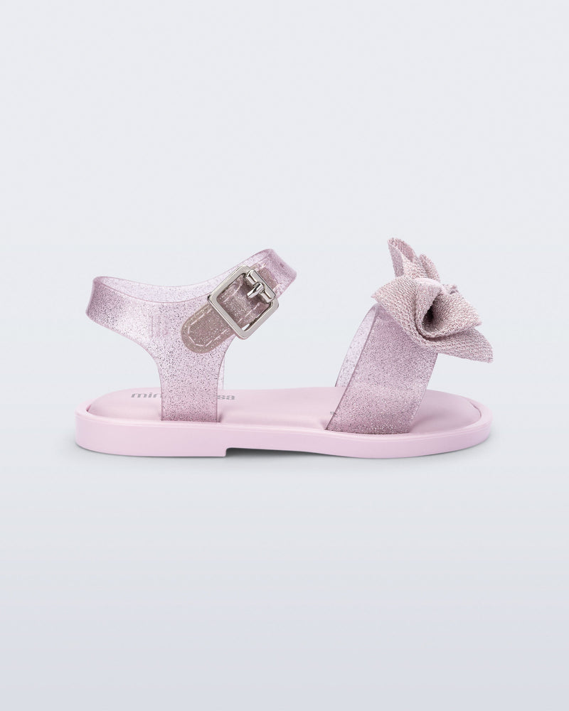 Side view of a glitter pink Mar Sweet baby sandal