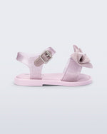 Side view of a glitter pink Mar Sweet baby sandal