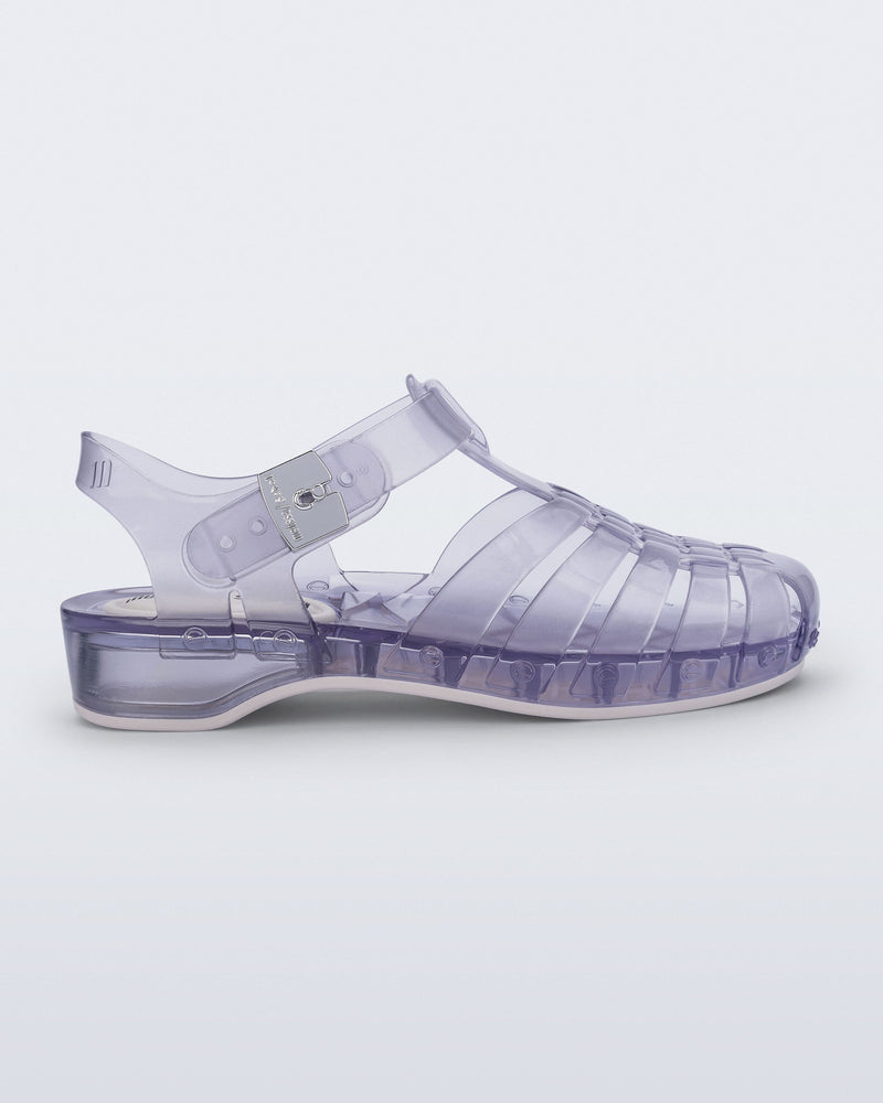 Side view of a clear Possession Pescura + Scholl fisherman sandal with white bottom sole