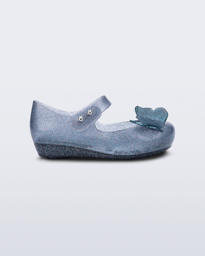 Side view of blue glitter Ultragirl Butterfly baby flats with butterflies on top