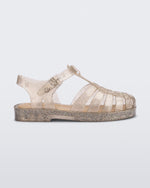 Side view of a glitter beige kids Possession sandal