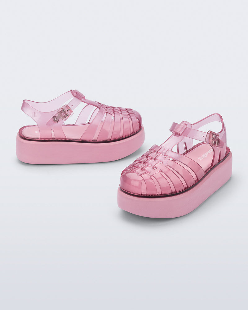 Back and angled view of a pair of pink Possession Platform kids fisherman sandals