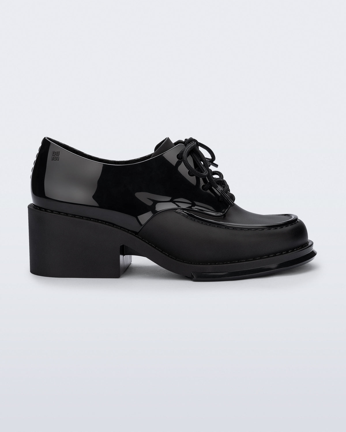 Side view of a black Tailor loafer with laces