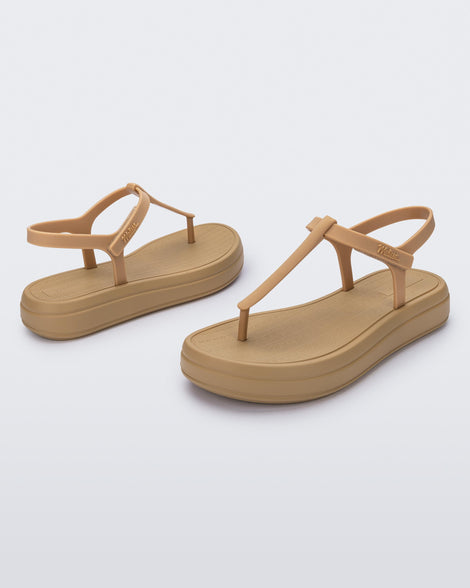 Angled and side view of a pair of beige Sun Leme Platform sandals