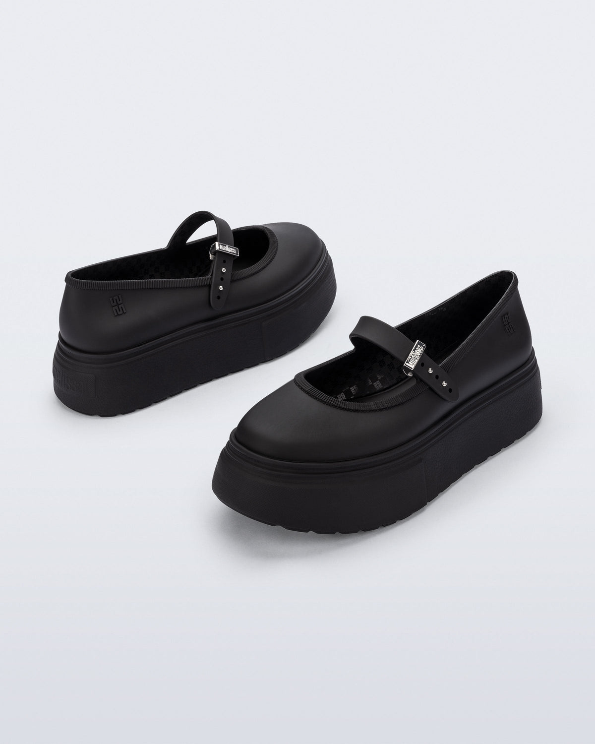 Back and side angled view of a pair of black Soft Ballerina Platform flats