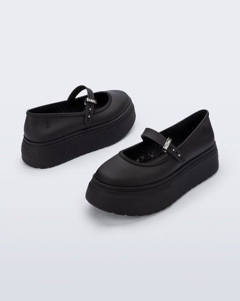 Back and side angled view of a pair of black Soft Ballerina Platform flats