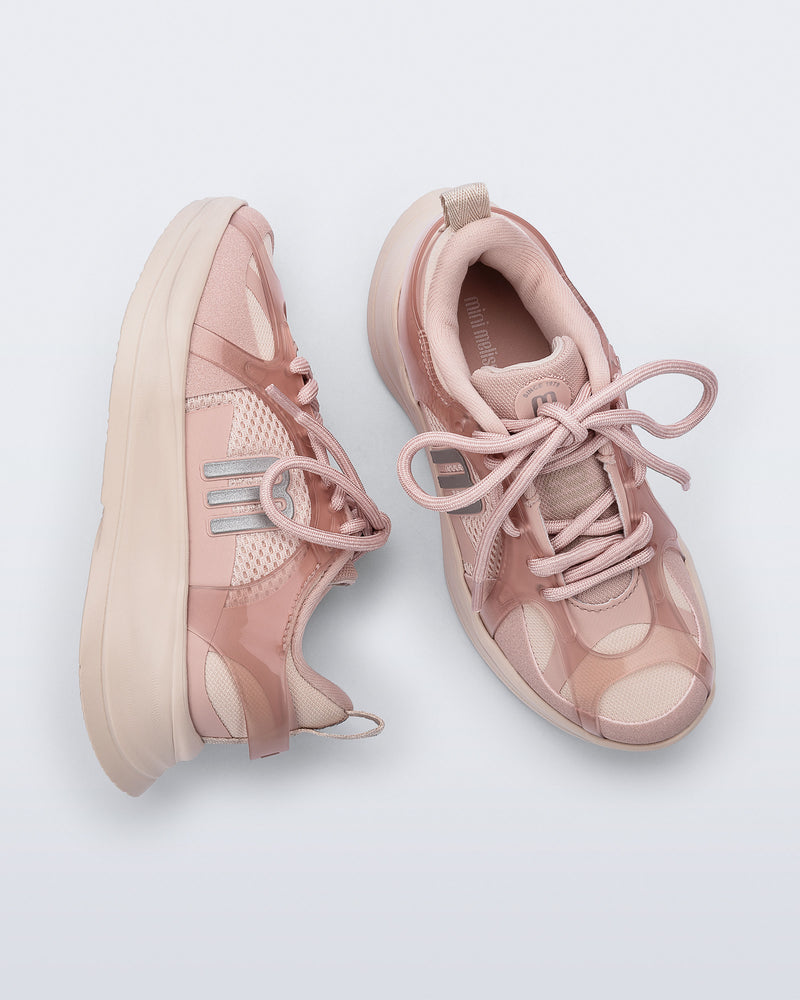 Side and top view of a pair of pink X Beat kids sneakers