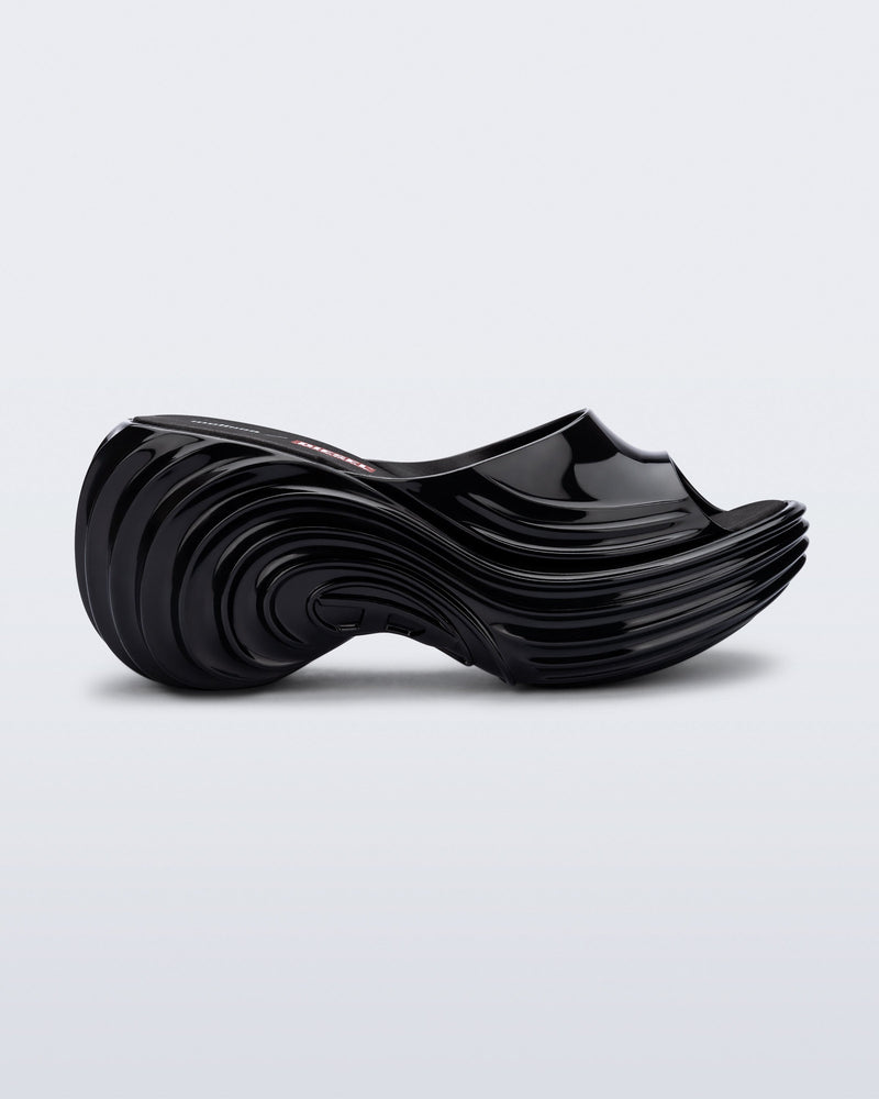 Side view of a black Platforms + Diesel slides