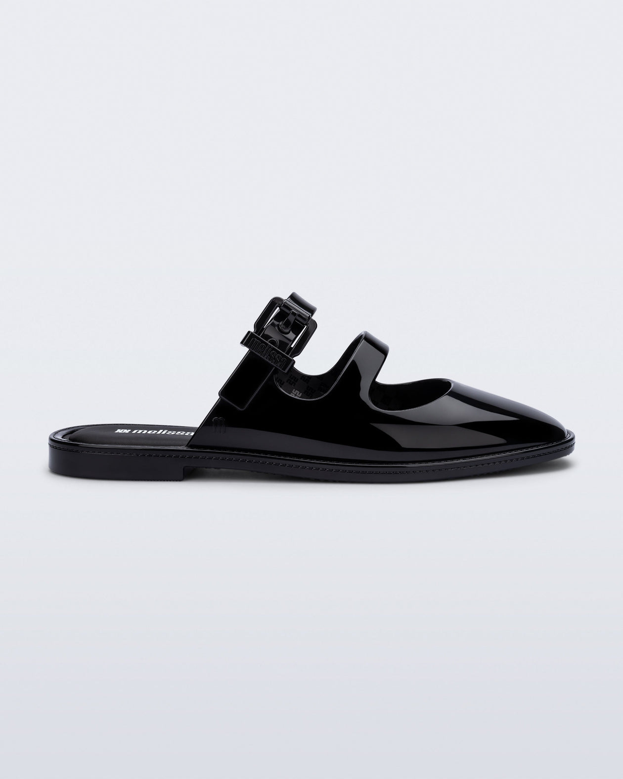 Side view of a black Anastasia mule slide with upper straps
