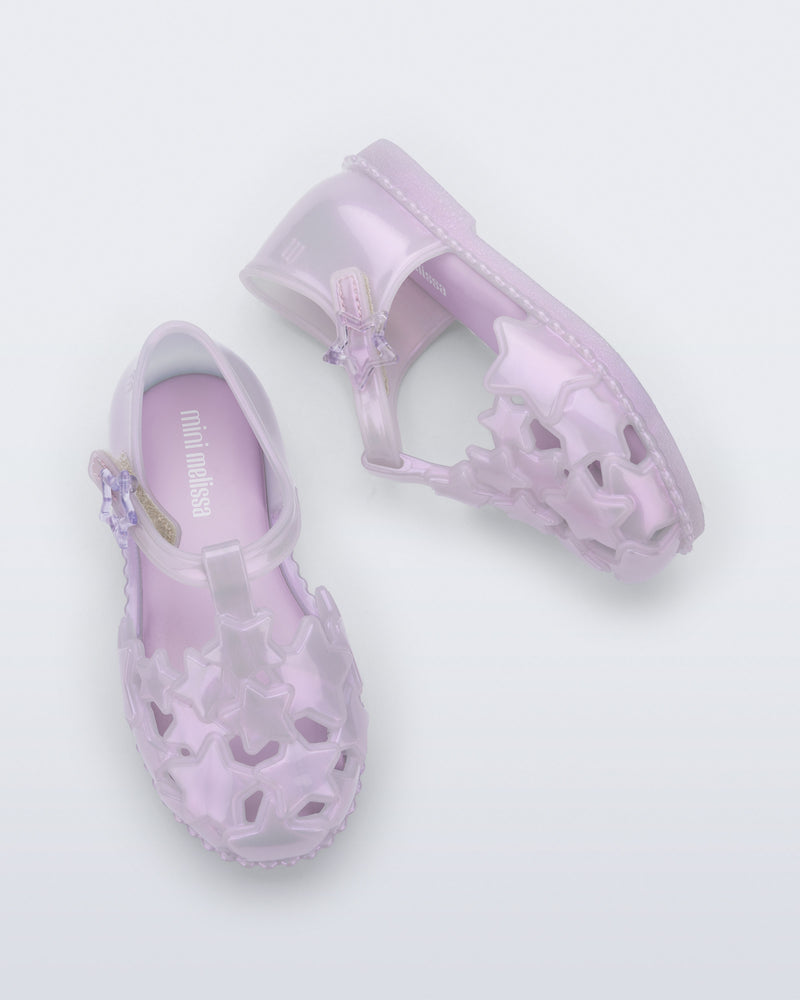 Side and top view of a pair of pearly lilac Starry baby sandals