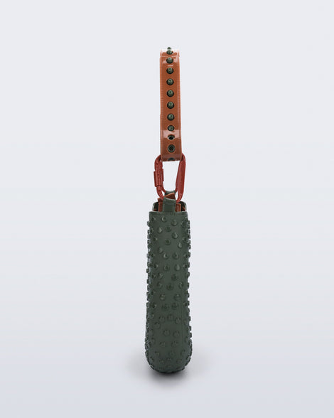 side view of a dark green Nina Bag + Alexandre Pavao shoulder bag with brown accents