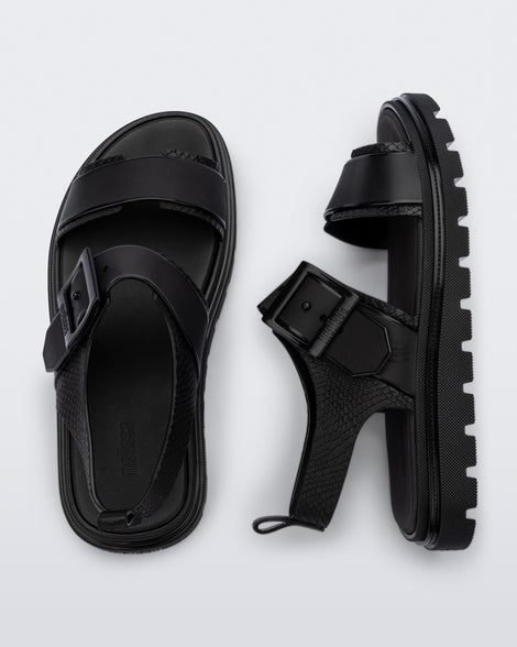 Top and side view of a pair of black Connection Papete sandals
