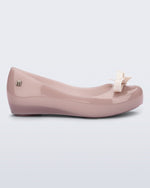 Side view of a pink kids Ultragirl Bow flat