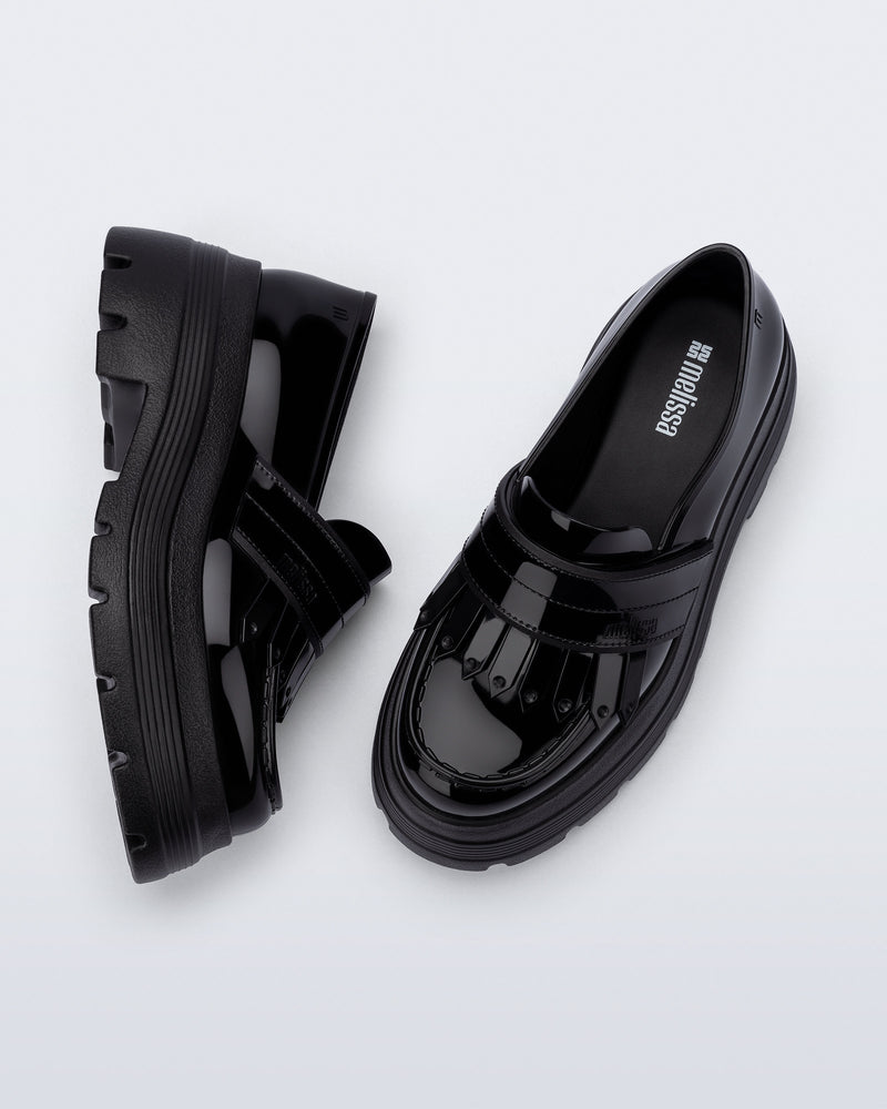 Top and side view of a pair of black Royal Plus Platform loafers