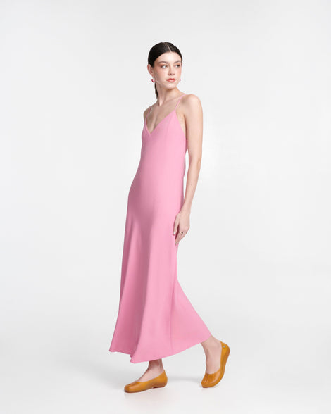 Model in a pink dress wearing a pair of clear yellow Ultragirl Futura ballerina flats