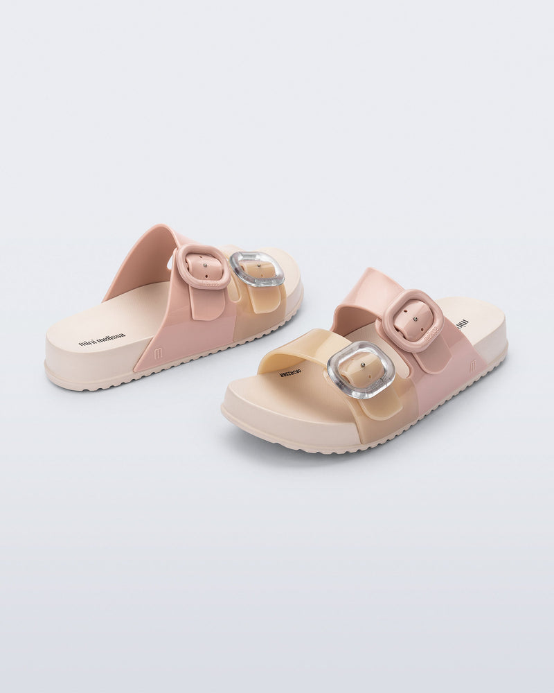 Back and front angled view of a pair of pink/beige Cozy kids slides
