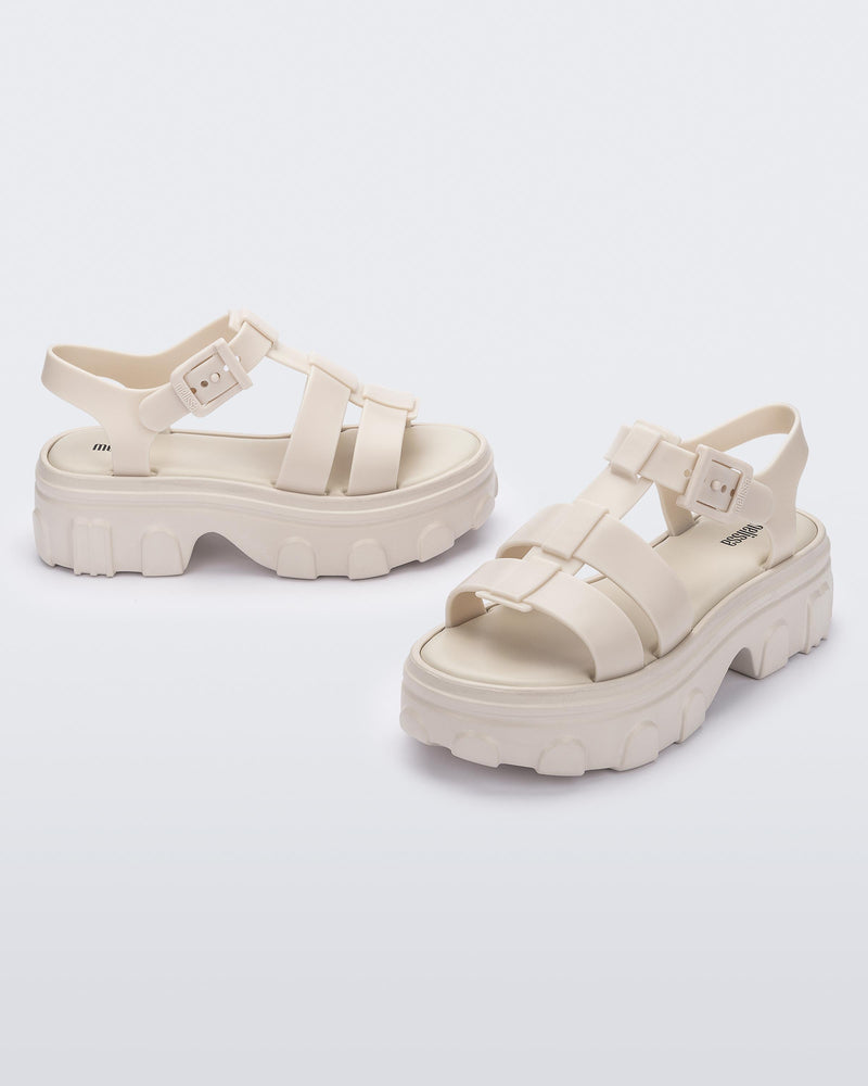 Side and front view of a pair of beige Ella women's platform sandals