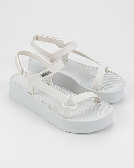 Angled view of a pair of white Sun Downtown Platform sandals