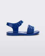 Side view of a blue Mar Wave baby sandal.