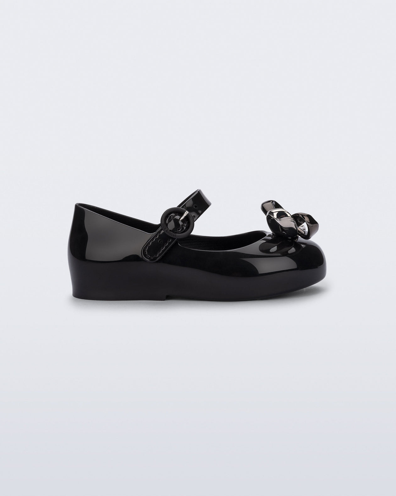 Side view of a black Sweet Love Glam baby ballerina with bow