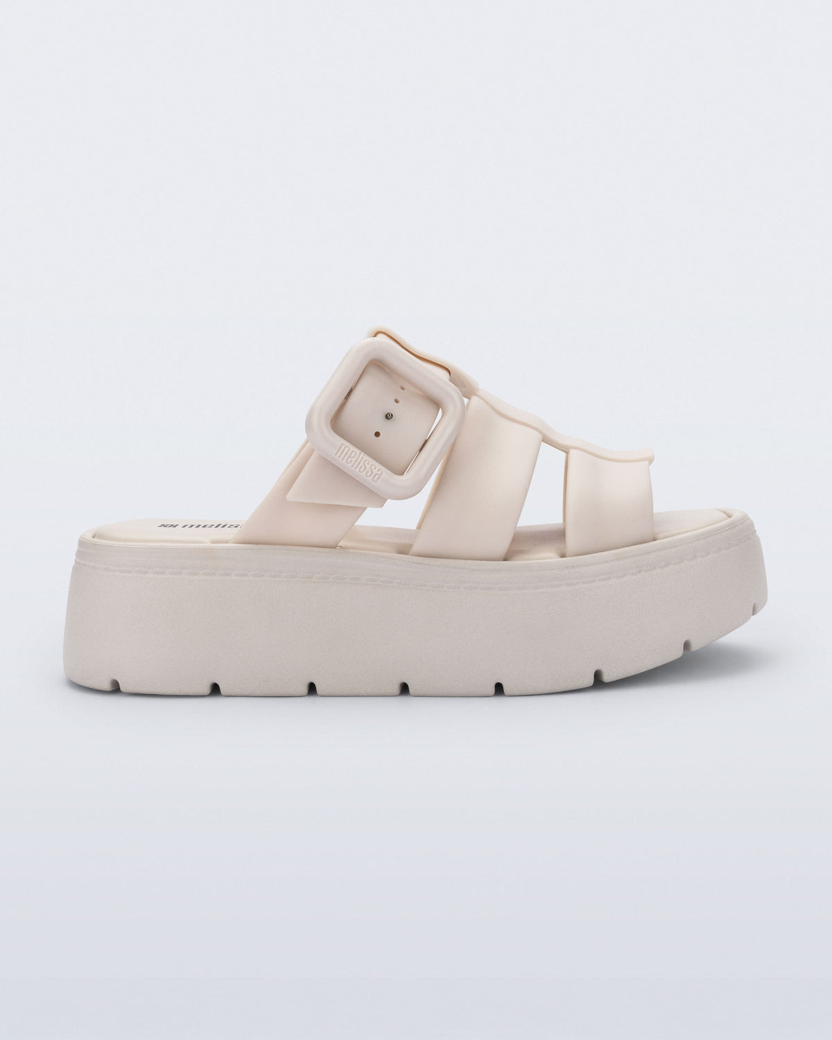 Side view of a beige Pump Platform sandal
