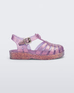 Side view of a glitter lilac baby Possession sandal