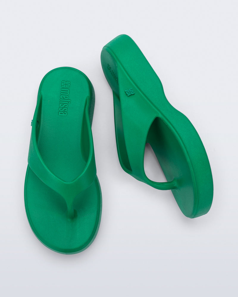 Top and side view of a pair of green Free Thong Low Flip Flops
