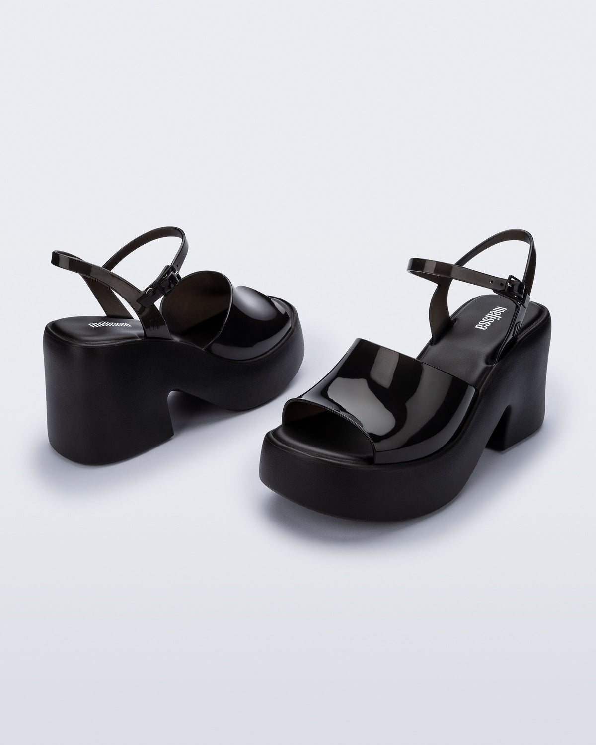 Angled view of a pair of black Lina platform heels