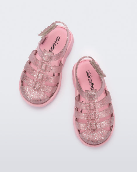 Top view of a pair of glitter pink Megan baby sandals.