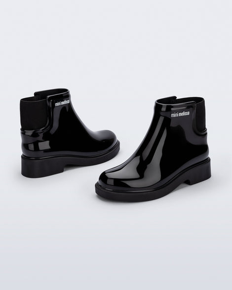 Back and side view of a pair of black Chelsea II kids boots
