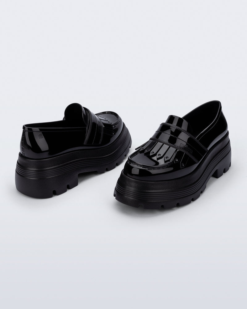 Back and angled view of a pair of black Royal Plus Platform loafers