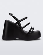 Side view of a black Jessie platform wedge sandal with side buckle ankle strap