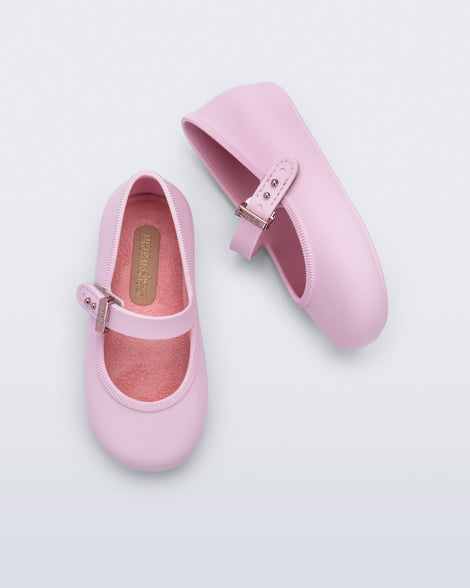 Top and side view of a pair of pink Soft Ballerina baby flat with Velcro strap