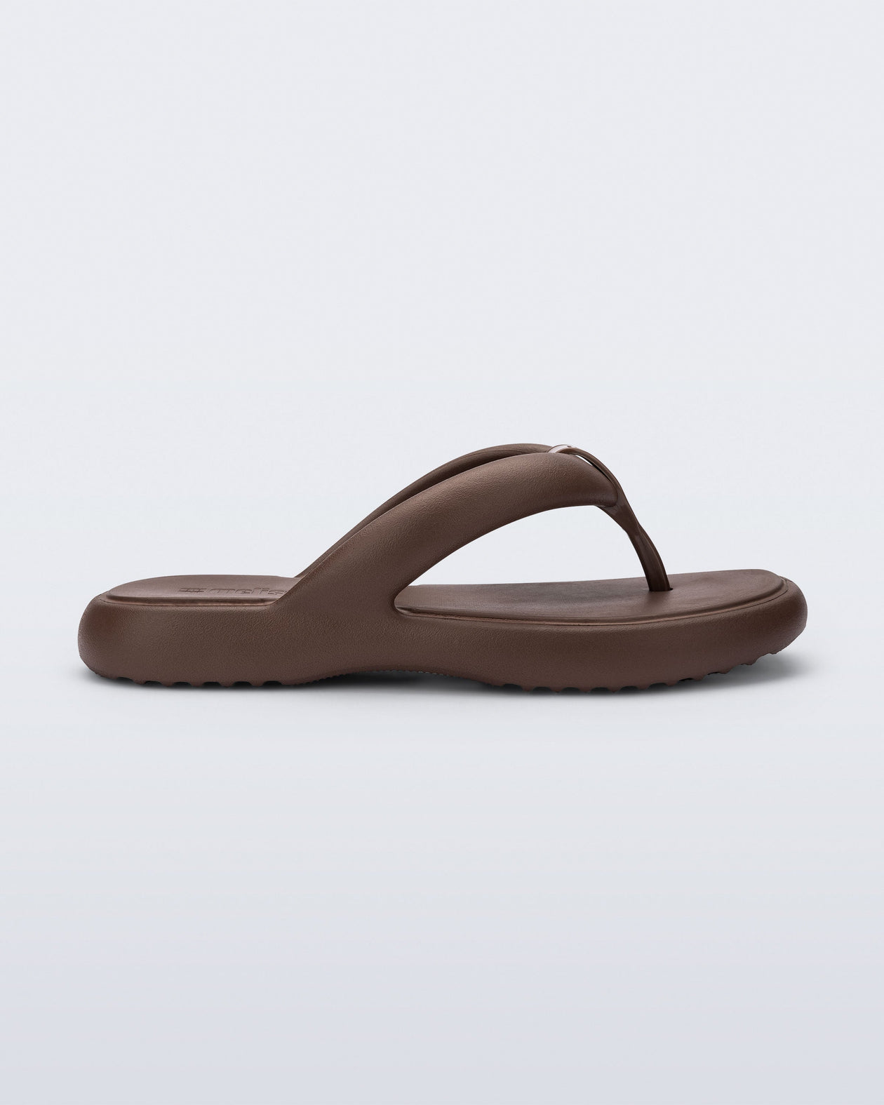 Side view of a bronze Free Low flip flop