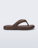 Side view of a bronze Free Low flip flop