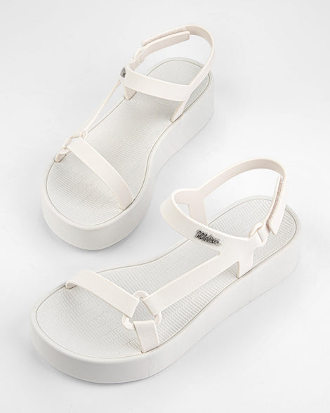 Top angled view of a pair of white Sun Downtown Platform sandals