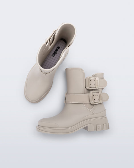 Top and side view of a pair of beige Bang Boots with two side buckles