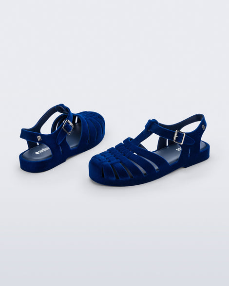 Side and back angled view of a pair of flocked blue Possession Velvet fisherman sandals